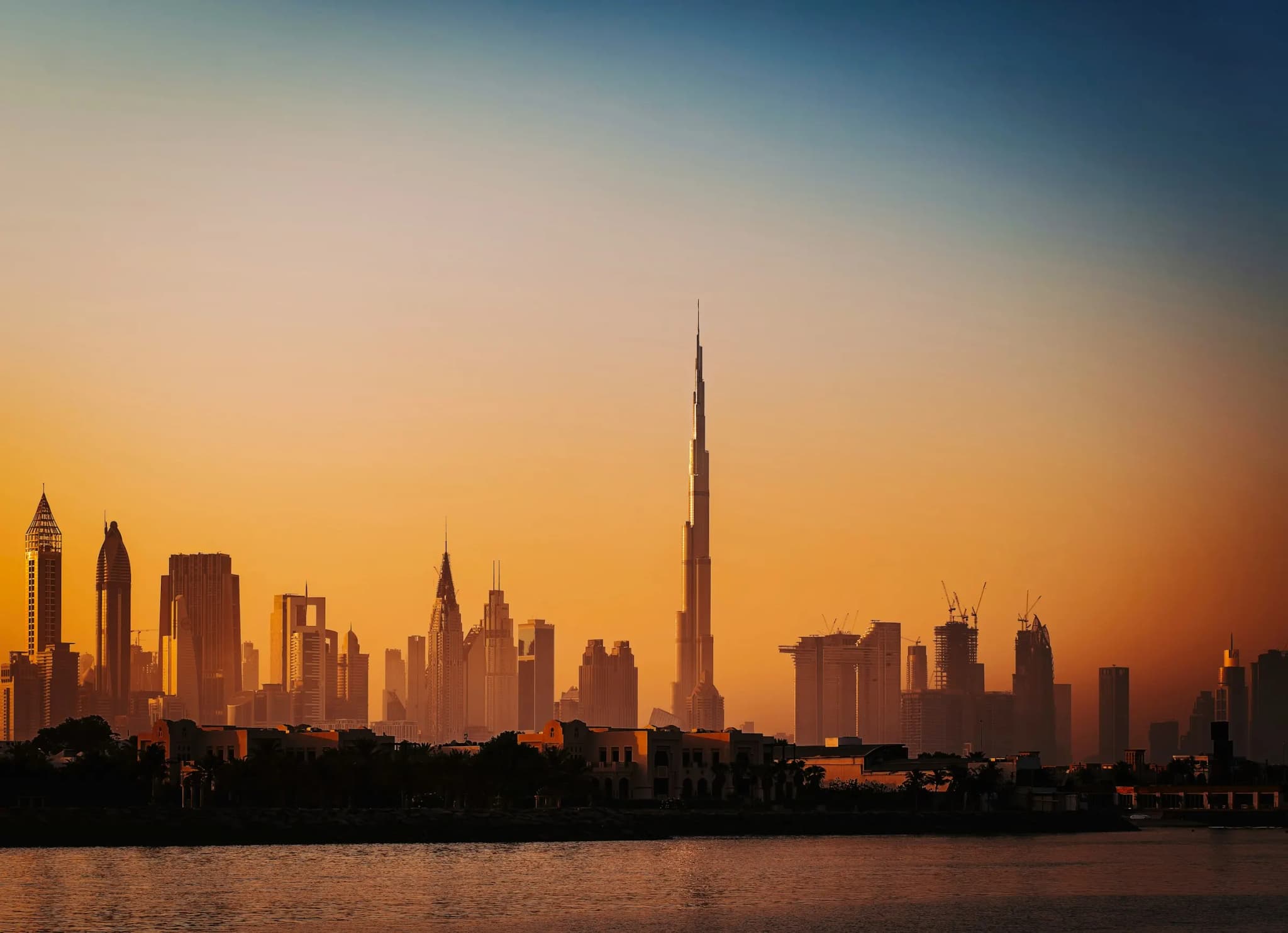 Downtown Dubai skyline and the Burj Khalifa at sunset