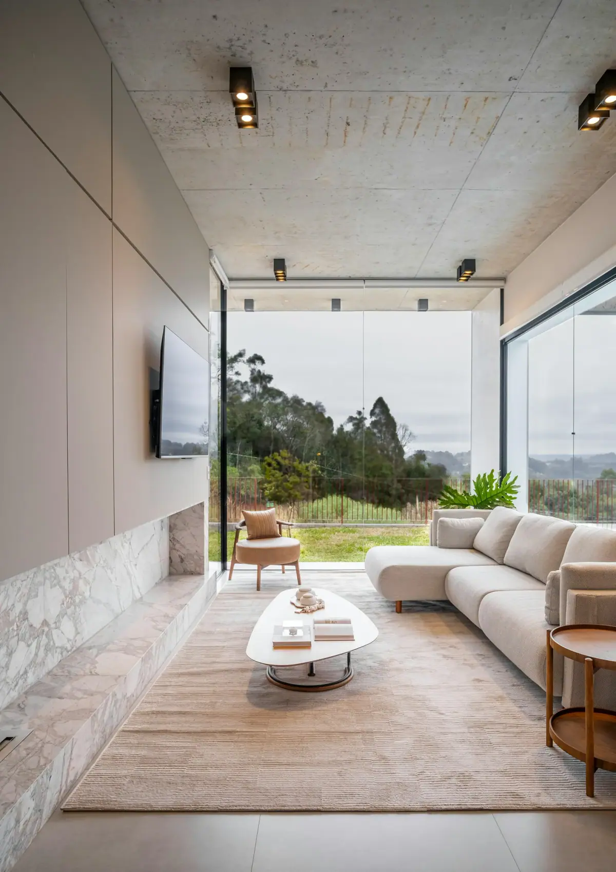 Bright modern living room with floor-to-ceiling glazing